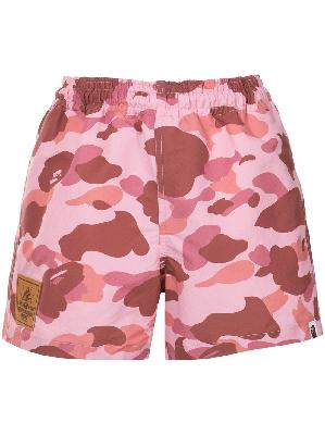 A BATHING APE® camouflage-print track shorts